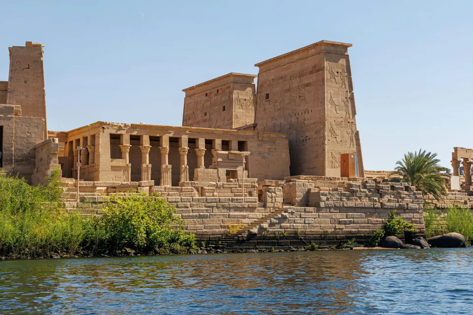 Stone temple buildings at the edge of the Nile