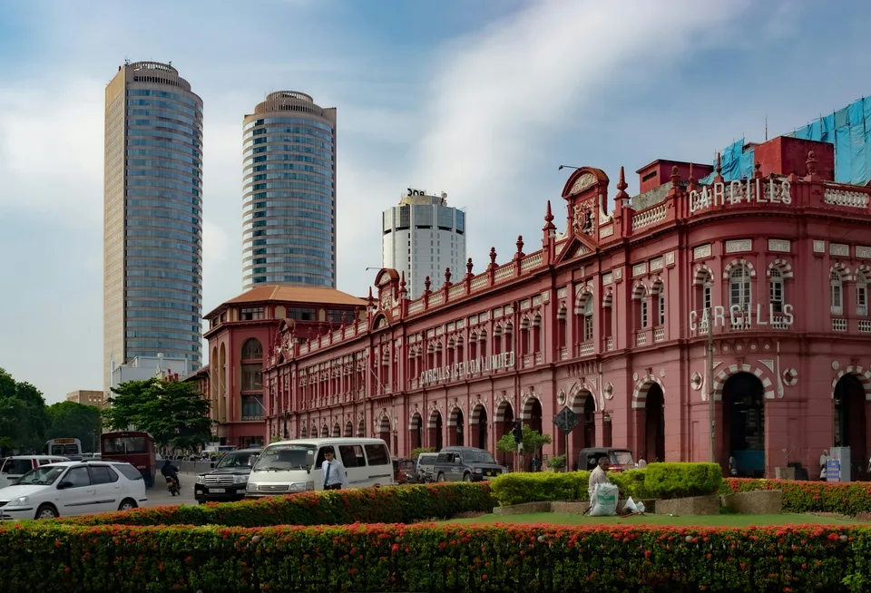 Colombo historic red-brick buildings with modern towers behind