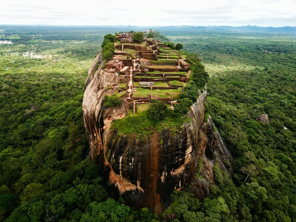 Ruins and gardens on the summit of Sigiriya surrounded by green plains
