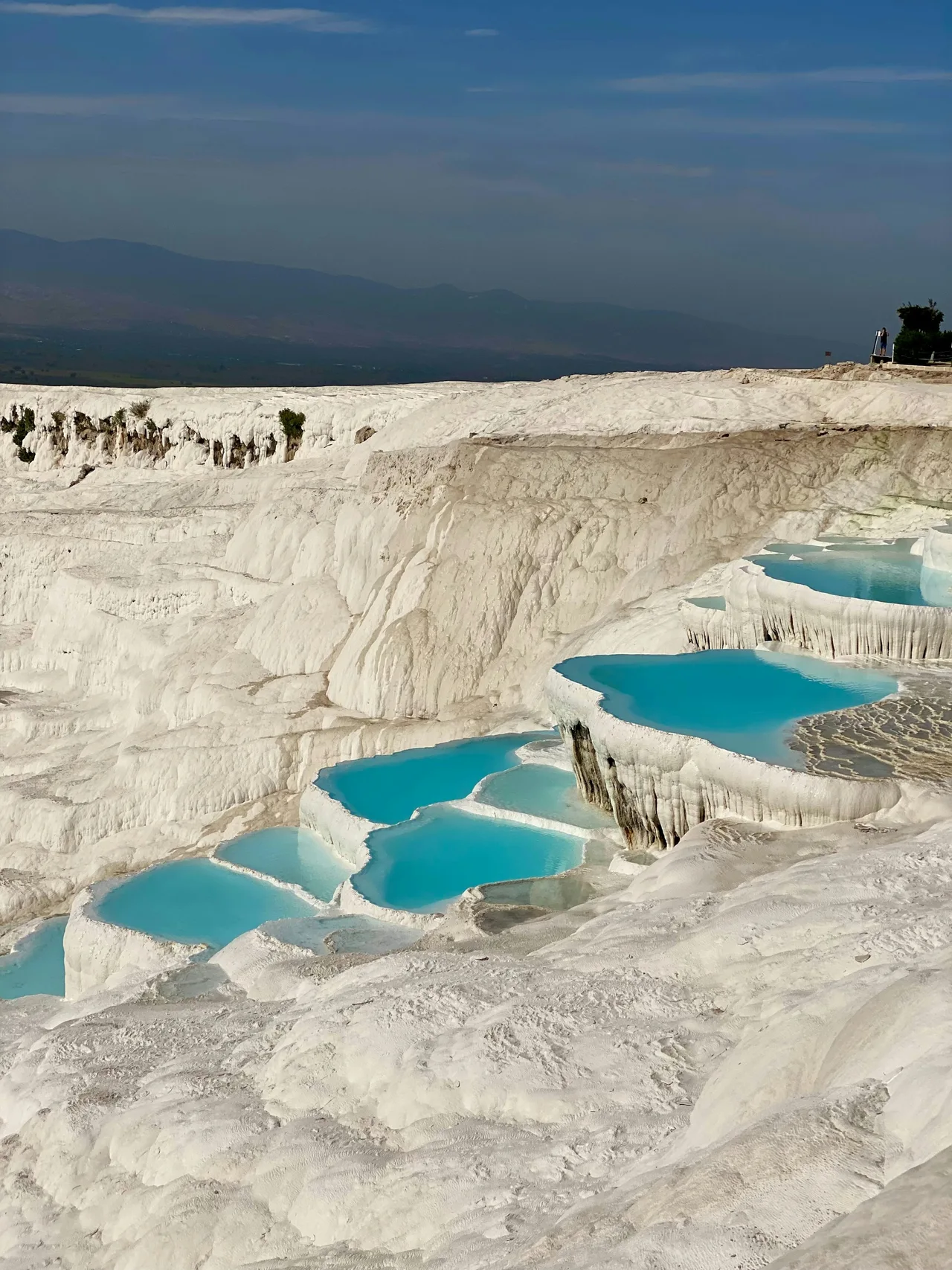 White travertine terraces filled with turquoise water at Pamukkale