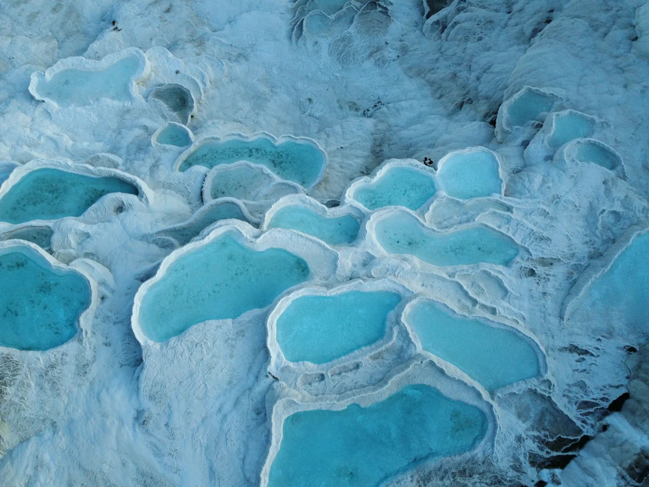 Mineral terraces and blue thermal pools at Pamukkale